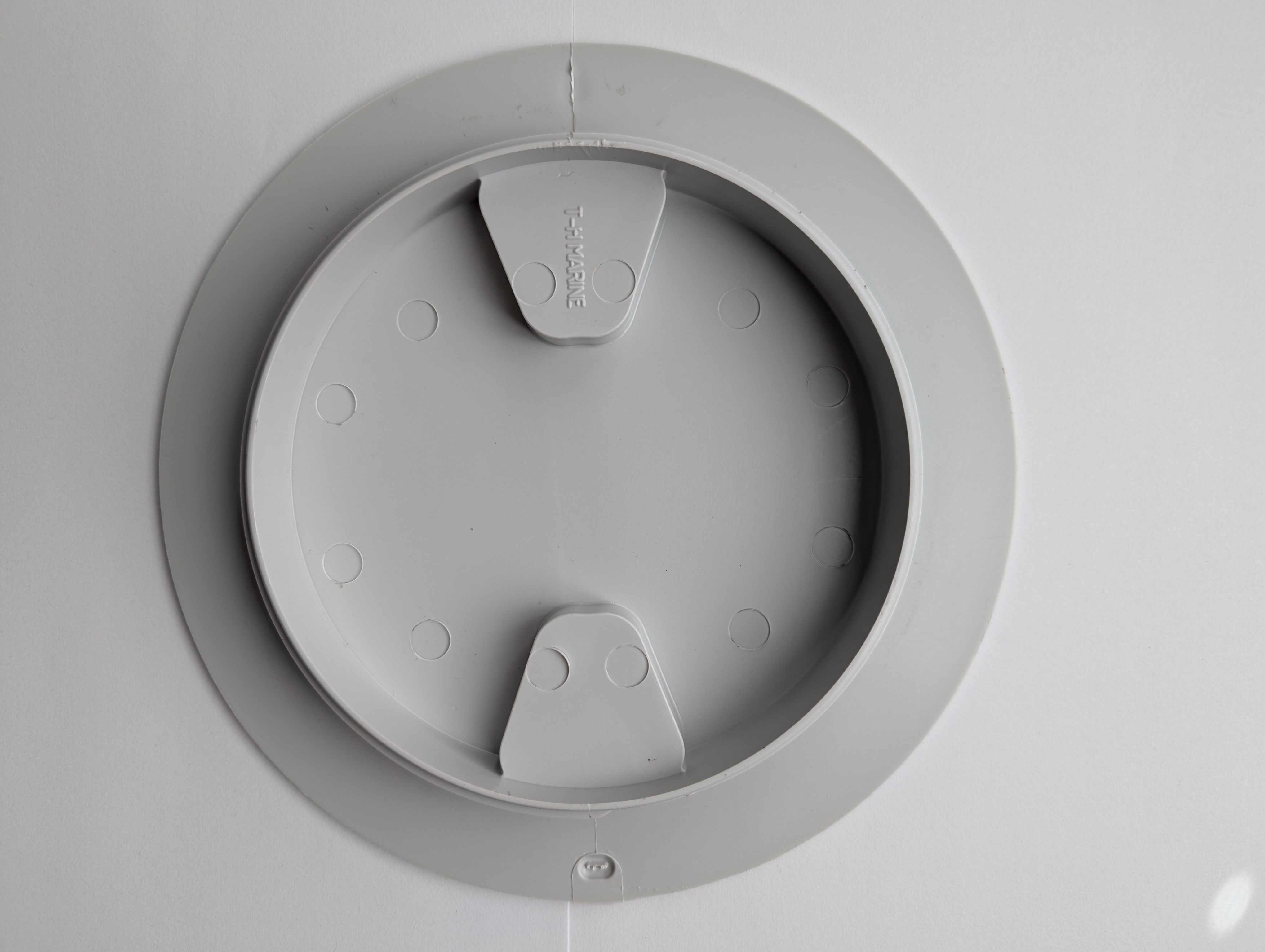 TH Marine 6 inch screw-in inspection port underside with molded T-H Marine name